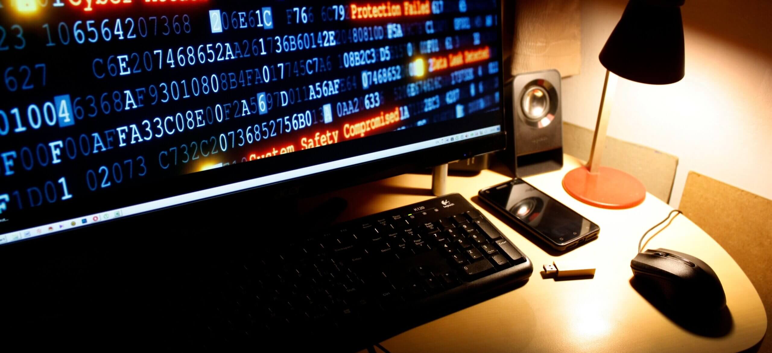 cyber-crime-cyber-attack-hacking-computer-desktop-MDCX8BS